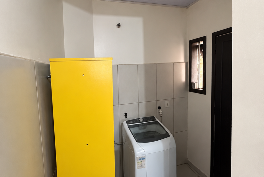 a_narrow_indoor_laundry_utility_room_photographed