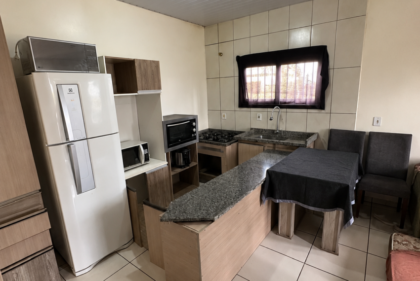 wide_angle_indoor_photo_of_a_tidy_kitchen_dining_a